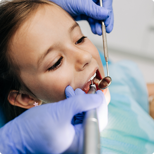 Close up of young child during dental exam