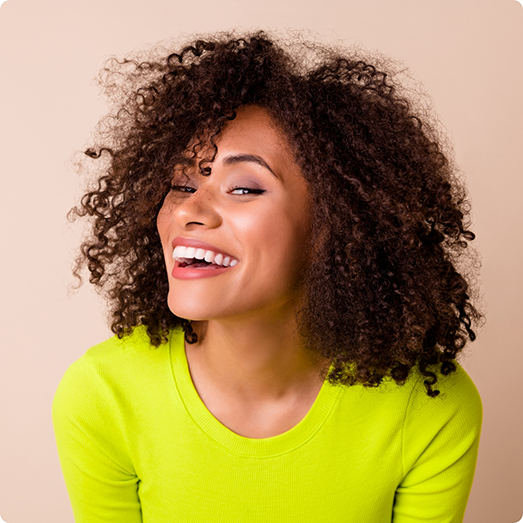 Woman in a yellow shirt smiling