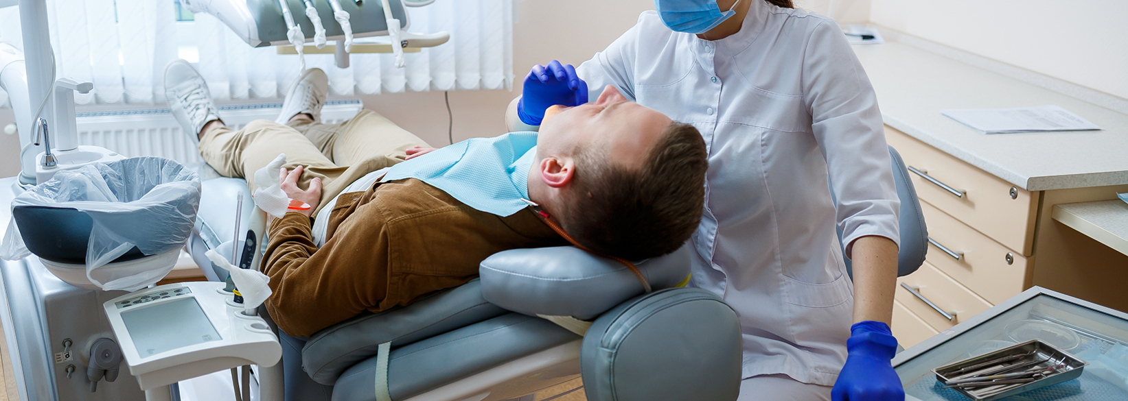 Man having his teeth checked for a preventive dentistry checkup in Fredericksburg
